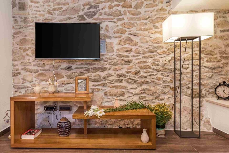  TV in a living room of a luxury pet-friendly villa for vacation with friends in Skradin
