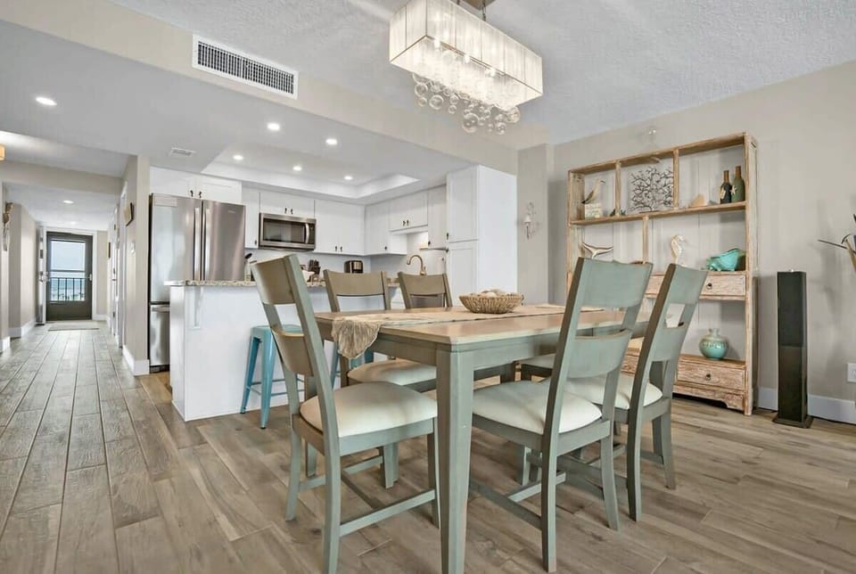 View from the living room to the dining table and into the kitchen.