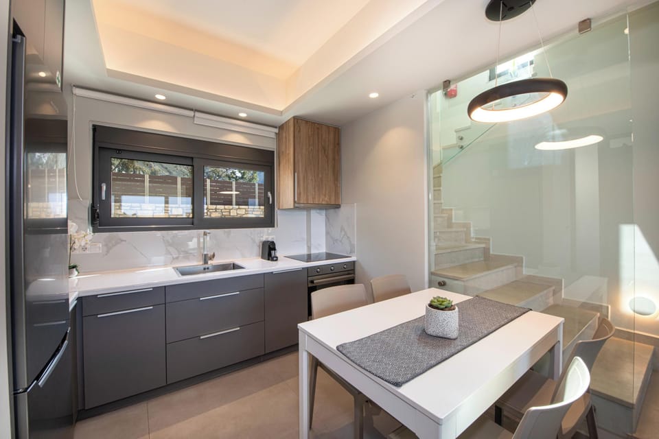 Fully equipped open plan kitchen with modern fixtures and appliances