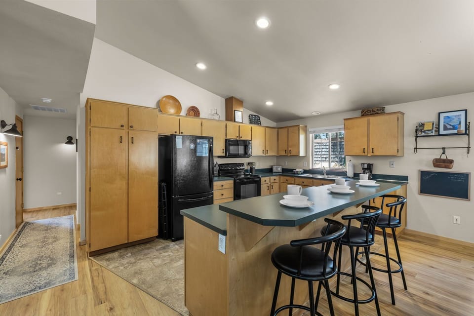 Gather around your spacious kitchen island for morning coffee or casual meals, with plenty of counter space and modern appliances ready for your culinary adventures.