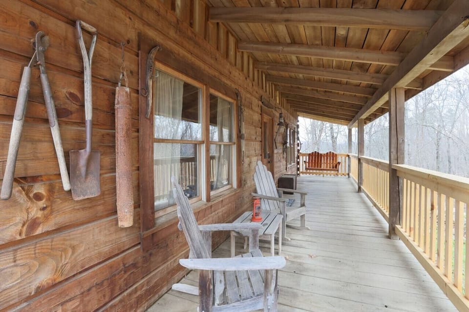 Front porch with rocking chairs and swing