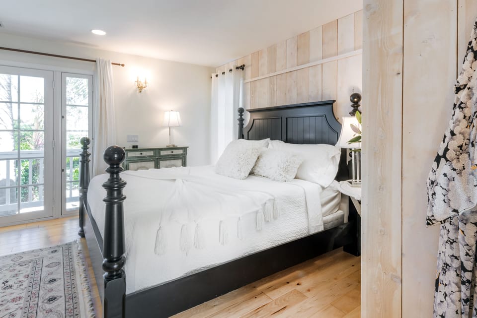 Master Suite w/King bed, fireplace, and large en-suite bath.  Pool view.