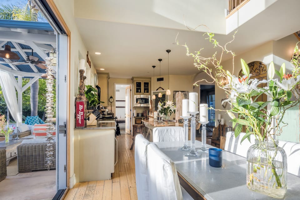 Sunny and bright open plan layout.  Dining area view through to the kitchen.