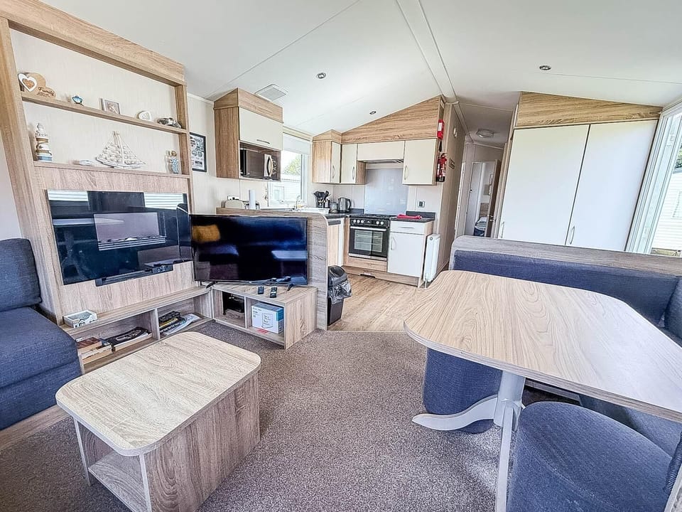 A family on holiday will love the comfortable living room in a caravan at Park Holidays Broadland Sands, a great base for enjoying things to do in Great Yarmouth, like the Hippodrome Great Yarmouth.