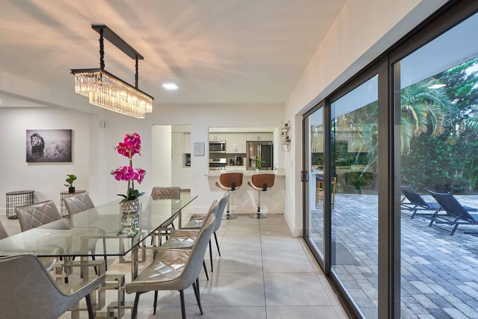 Elegant dining table next to the backyard..