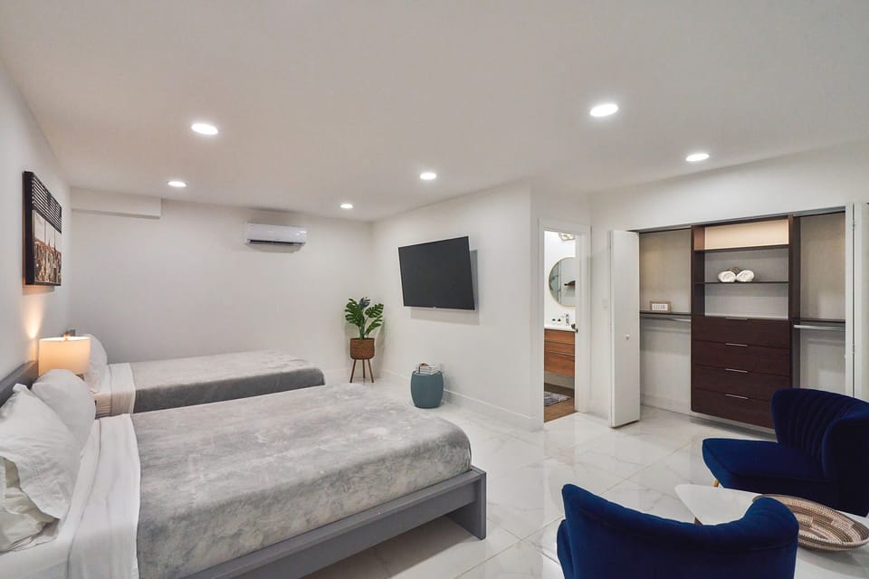 Bedroom #5: Two Queen size beds, a closet and a Smart TV.