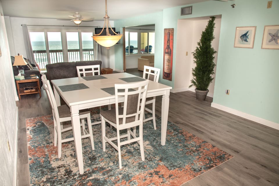 View of ocean from dining room through both family room and 3rd bedroom