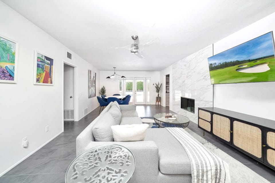 Living Room with Smart TV. Fireplace is decorative only and guests should not use it.