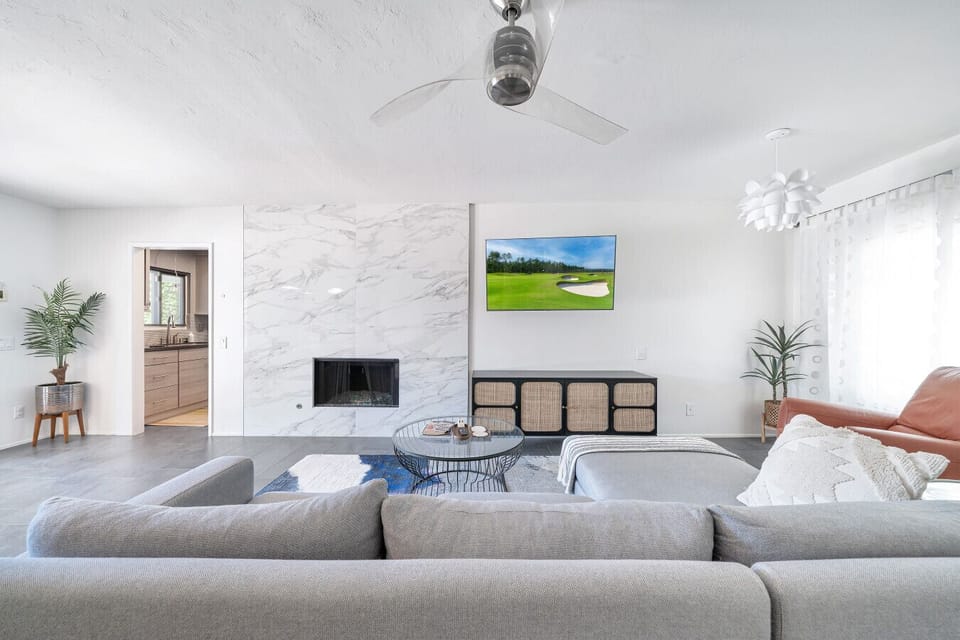Living Room with Smart TV. Fireplace is decorative only and guests should not use it.