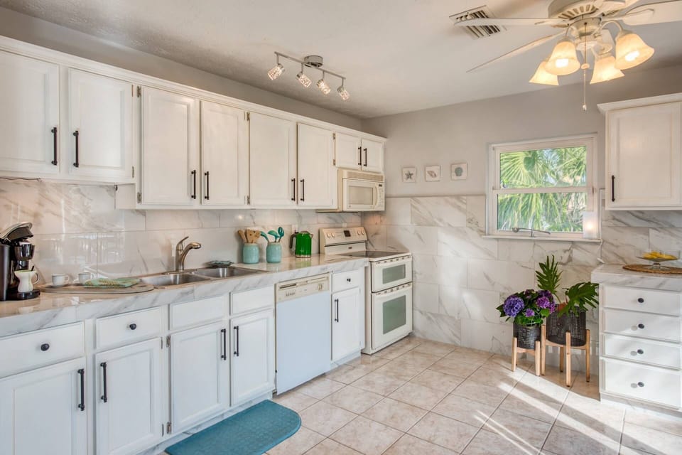 Beautiful kitchen is stocked with all you need for make your favorite meals.