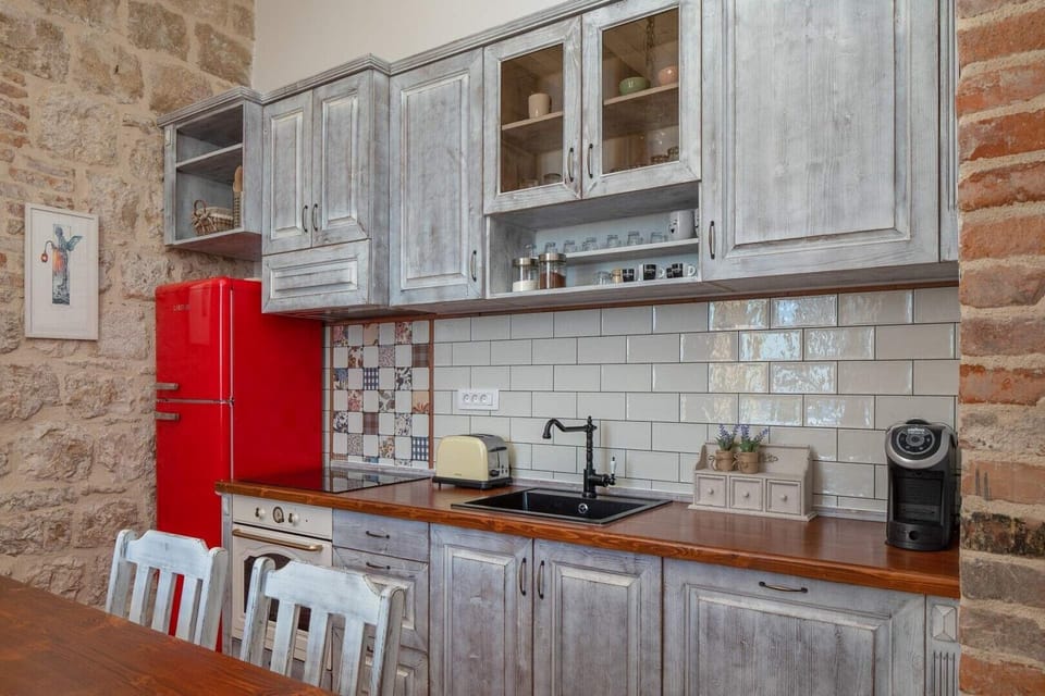 Equipped kitchen in rustic style in seafront luxury villa Vis for total privacy by the sea.