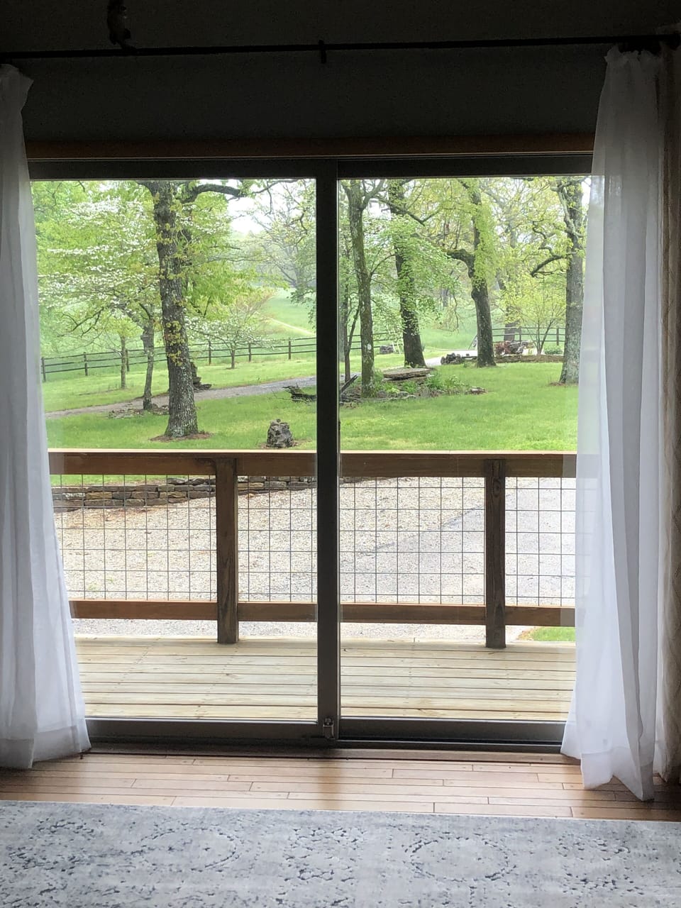 Bunk room view of front driveway out to hayfields.