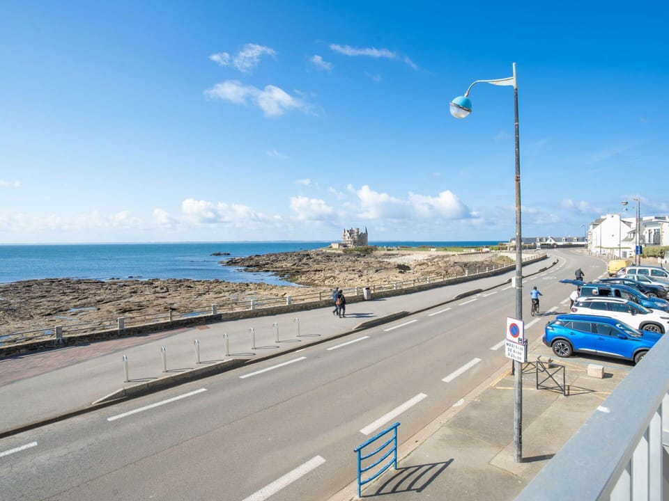 Sky, Cloud, Street Light, Water, Road Surface, Asphalt, Coastal And Oceanic Landforms, Car, Road, Vehicle