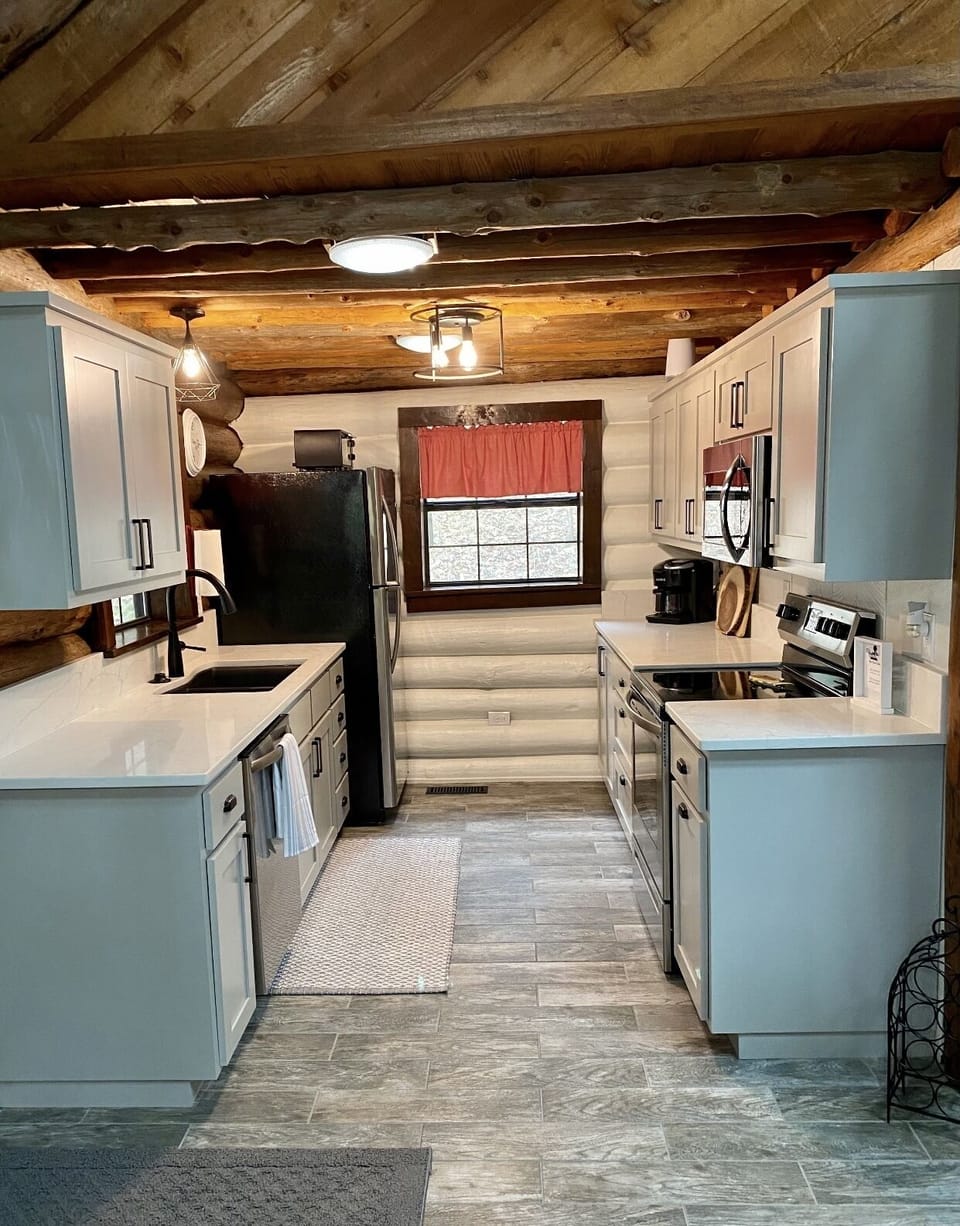 Remodeled kitchen with modern amenities and fully stocked with cooking utensils