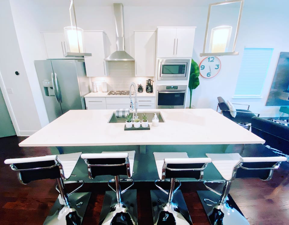 Large island with seating for the kitchen hang out. 