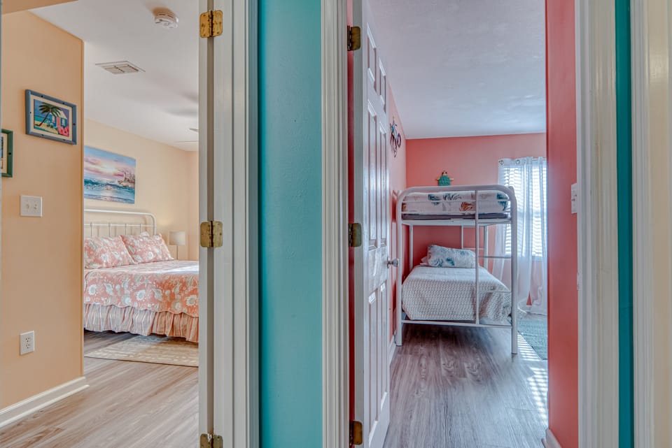 Bedrooms - This unit offers 2 bedrooms. One features queen bedding, and the other offers 2 sets of bunk beds.