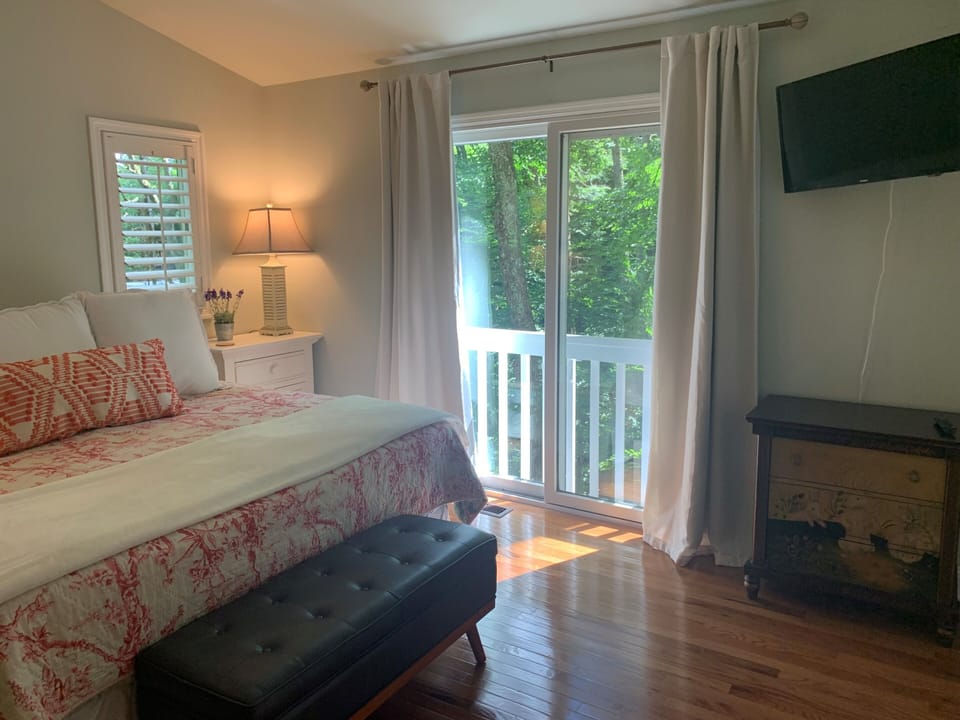 Master bedroom overlooks wooded back yard on 1.3 acre lot