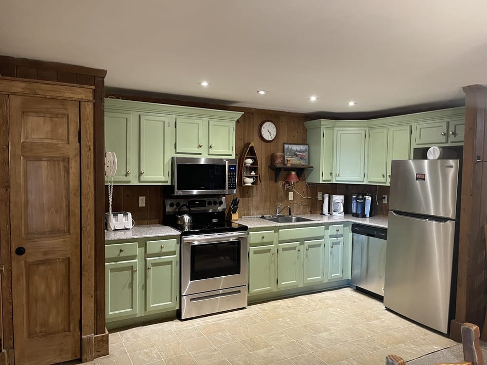 Kitchen with granite countertops and outfitted ready for family meals