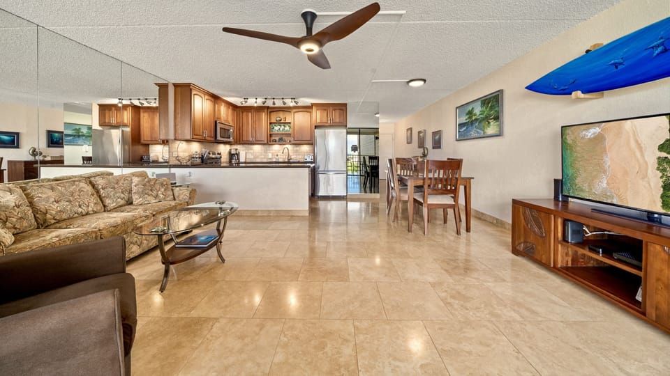Spacious front room with Italian travertine floors and Haiku ceiling fan.