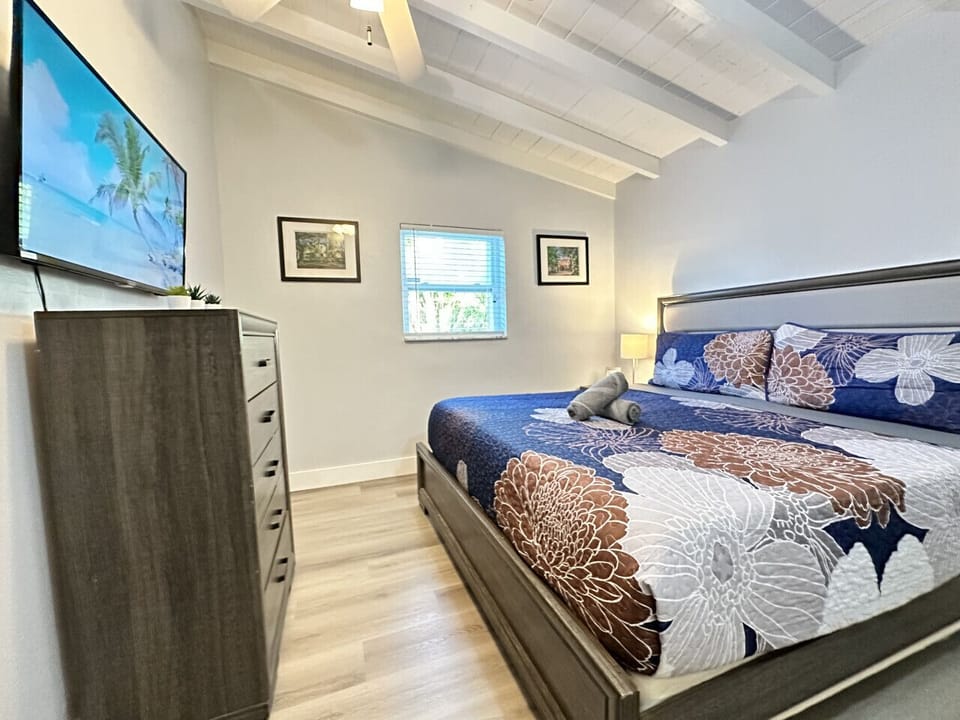 Bedroom with a king bed and a tv