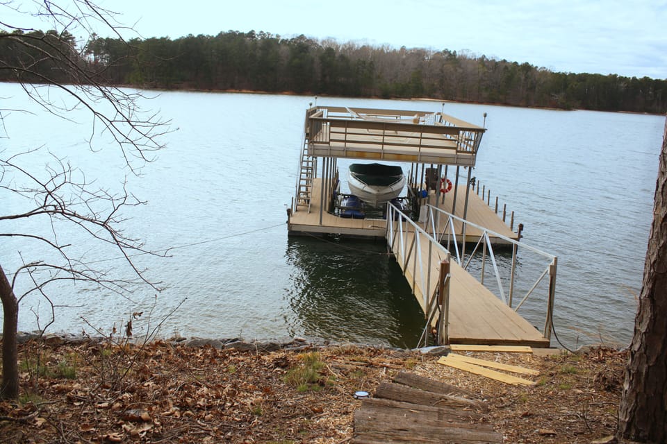 This dock has it all, sundeck, party deck, and room for up to 3 boats.