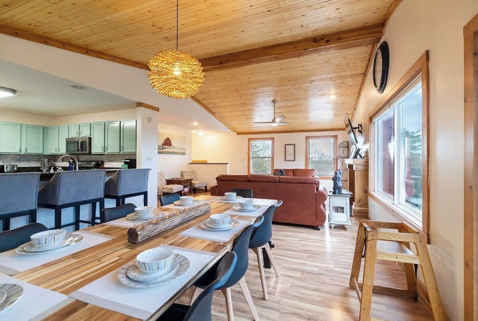 8 seats at the dinner table, and 3 bar chairs at the kitchen