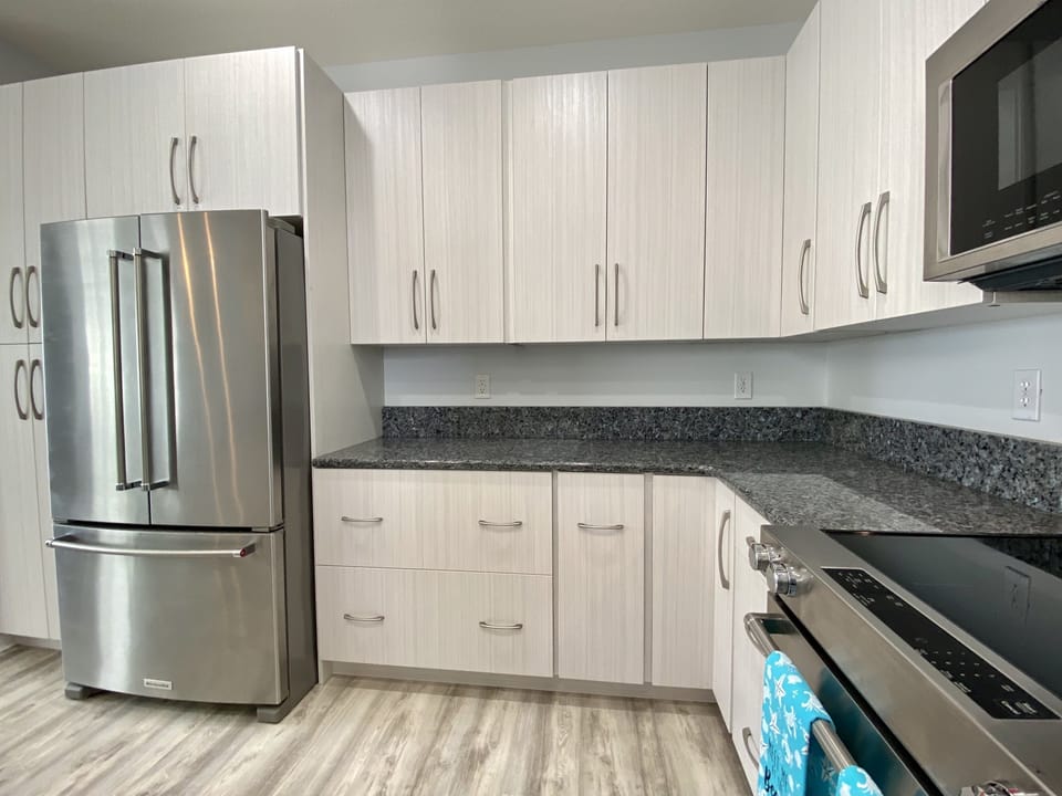 Updated kitchen with Kitchen Aid stainless steel appliances.