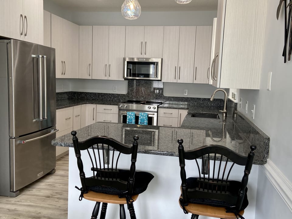 Updated kitchen with Kitchen Aid stainless steel appliances.
