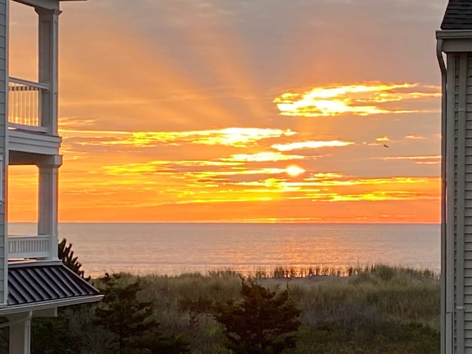 Morning sunrise over the ocean from the second floor private deck.