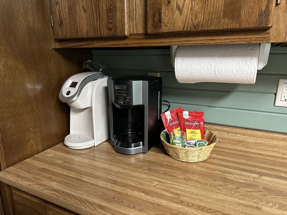 K-cup machine, 12 cup coffee pot and starter coffee & sweetener provided.