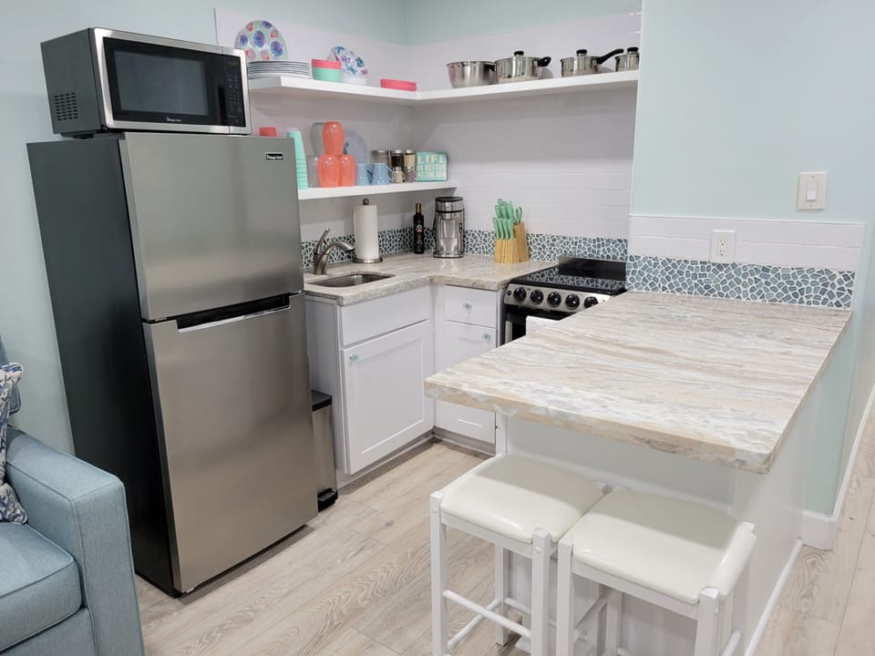 Fully stocked kitchenette , coffee, cream  and suger provided. kona