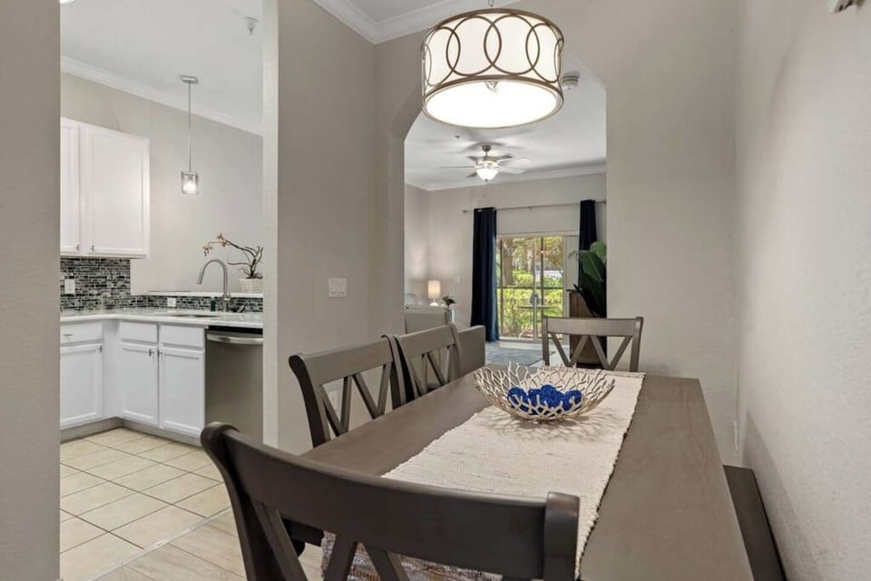 The dining table has a bench tucked under the table, allowing 6 to eat together