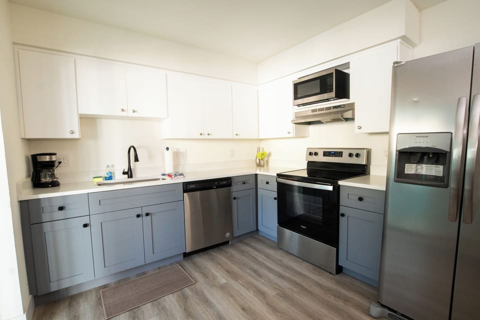 Our renovated kitchen gives you all the amenities of home, esp if you want to make your own meals (or cocktails).  The kitchen is complete with a stainless steel dishwasher, microwave, oven, and coffee maker, blender, can opener...