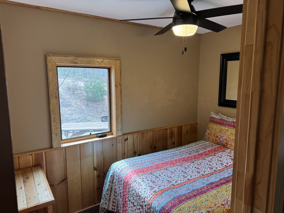 Third bedroom on main floor level with full size bed.