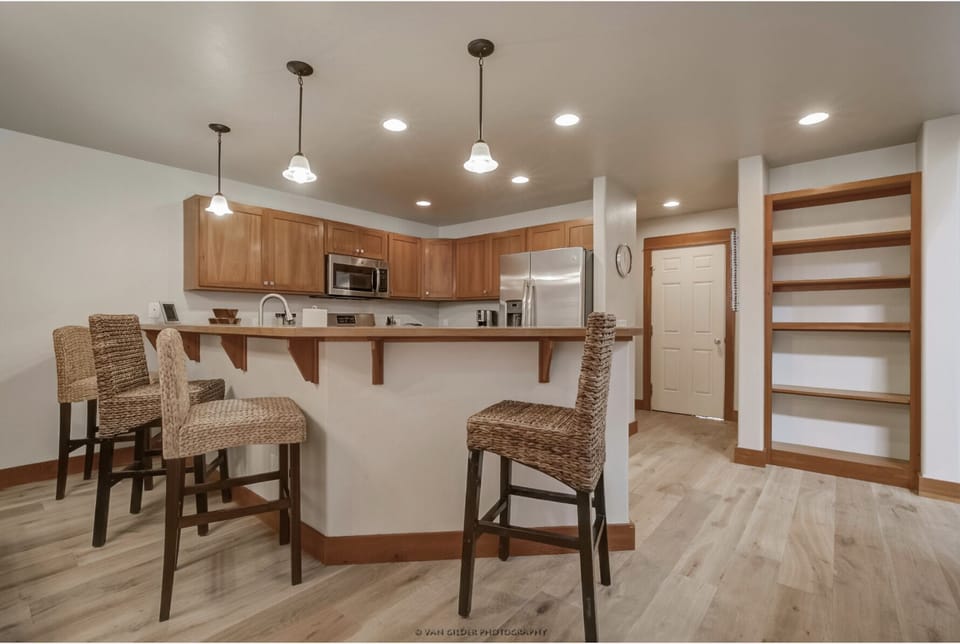 Spacious kitchen with bar seating.