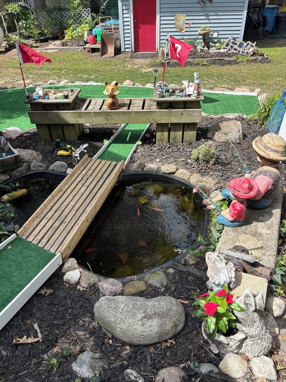 Bridge goes over koi pond