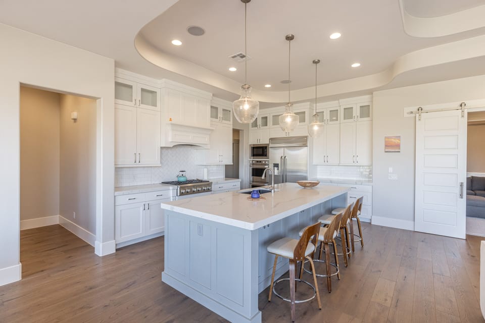 Kitchen - The kitchen is fully stocked with all the dishes, cookware, baking pans, and cutlery you will need for meal preparations and includes stainless steel appliances and granite counter tops.