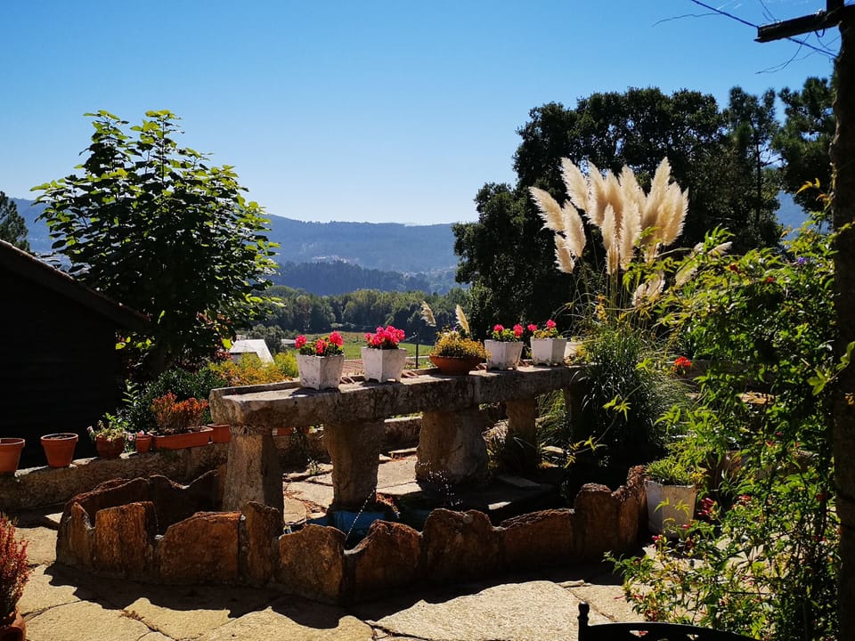 View over fish pond to Portuguese hills and estuary