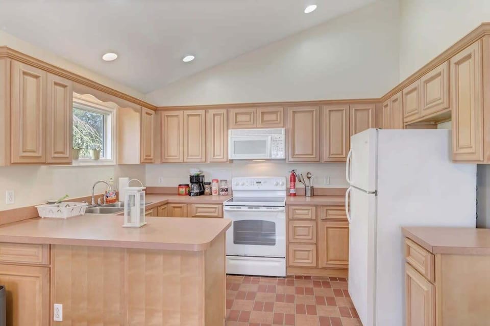 Spacious kitchen includes coffee, tea, and modern appliances