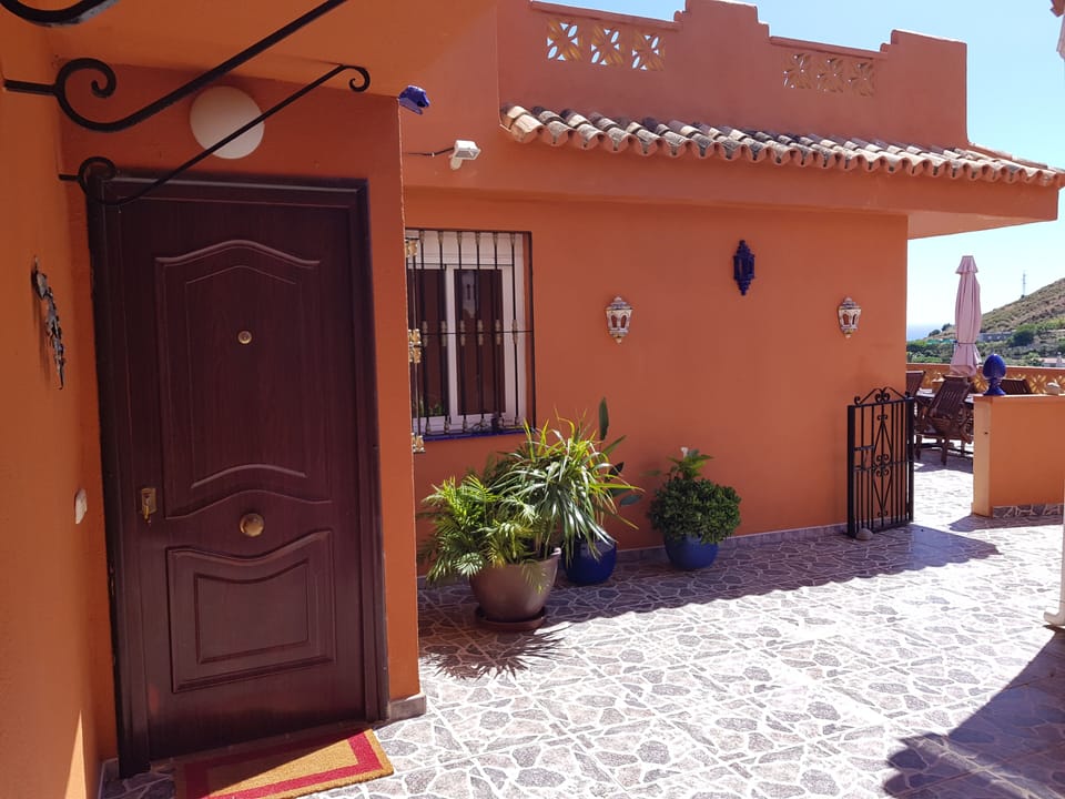 Entrance with terrace on the right.