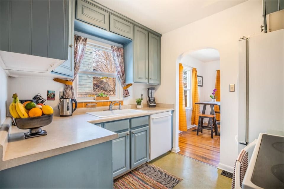 A sleek kitchen with spacious cabinets to keep everything in place
