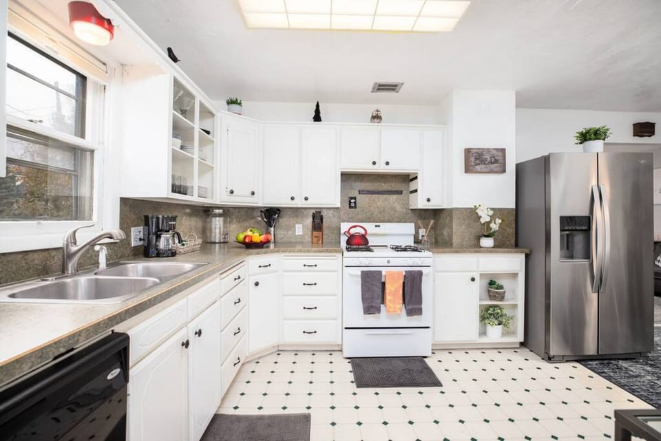 Experience culinary convenience in our spotless kitchen, complete with all essentials and a modern refrigerator.