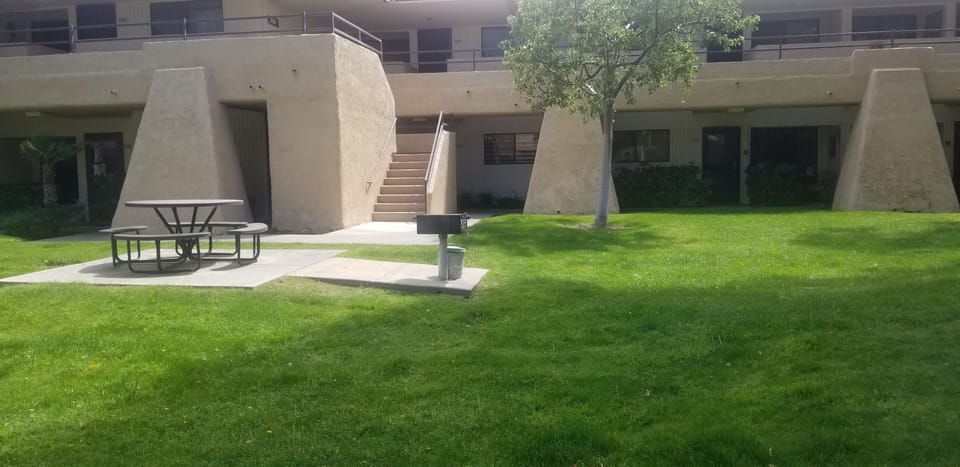 bbq area infront of pool by unit