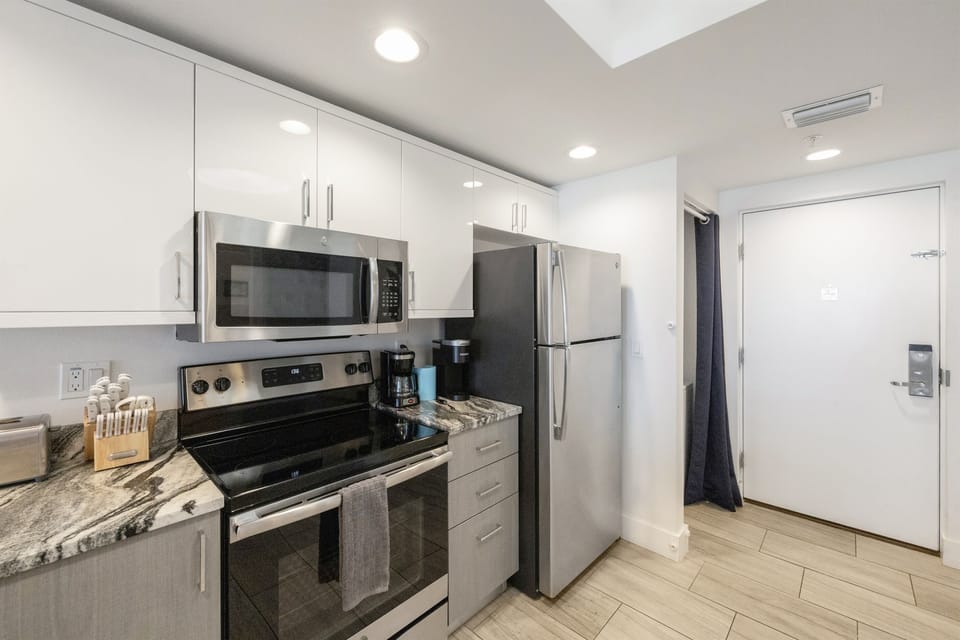 Kitchen, fully stocked with cooking/eating utensils