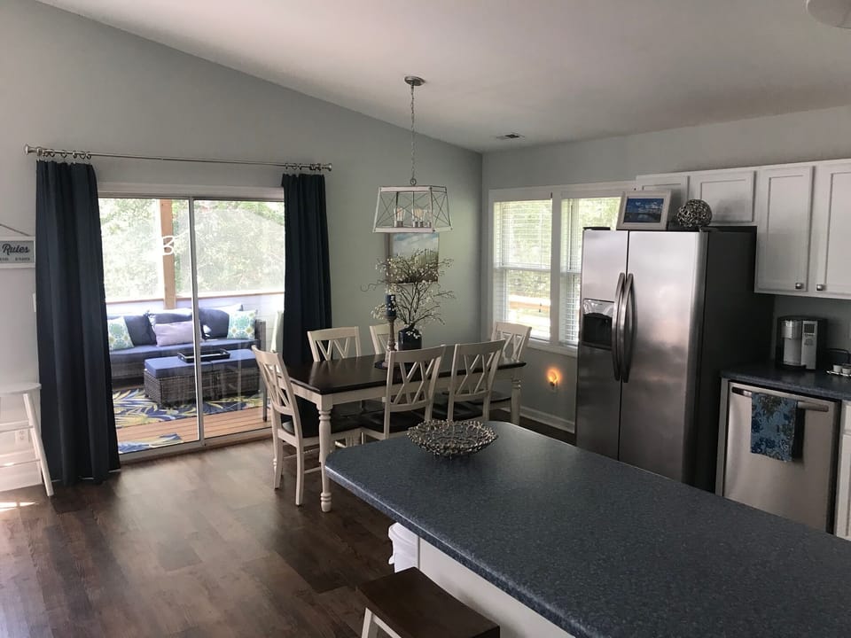 View from hallway toward front of house in dining room.