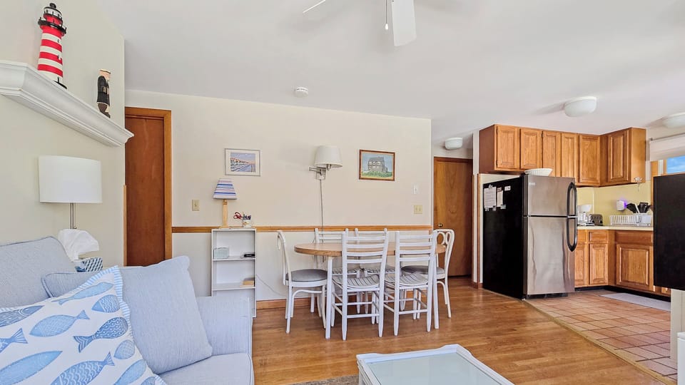 Living room with dining area and kitchen beyond