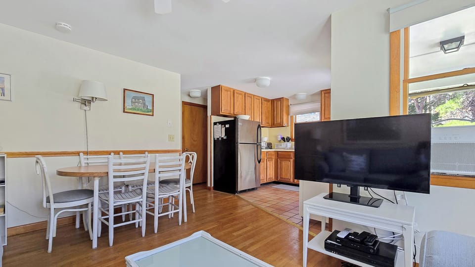 Living room with dining area and kitchen beyond
