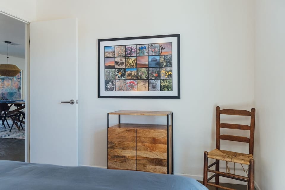 Bedroom adjacent to dining room and living room areas.