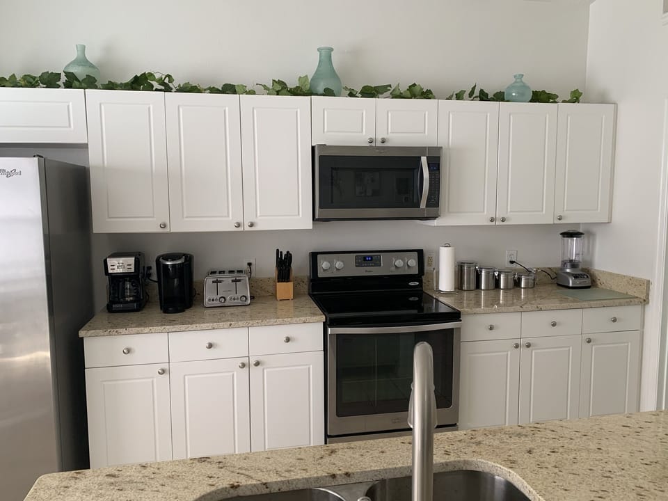 Multiple coffee makers (drip and K-Cup), Toaster, Stove, Oven and Blender