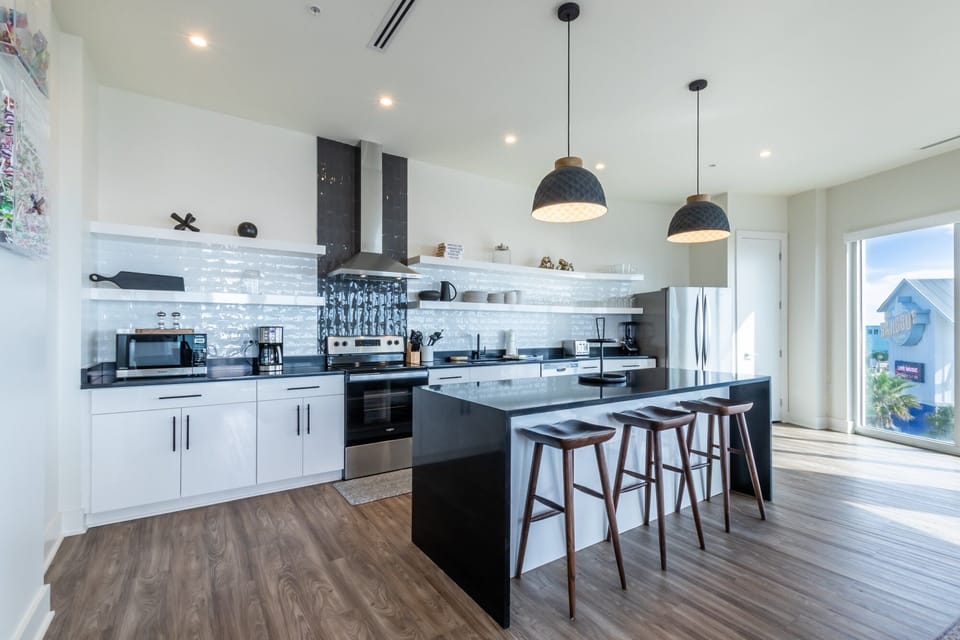 Spacious kitchen equipped with modern appliances and cooking basics to make you favorite meals!